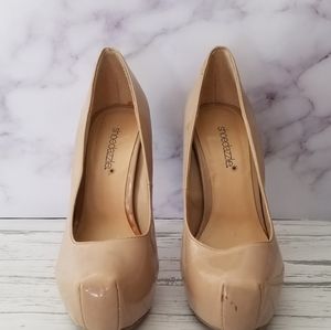 Beige patent pumps